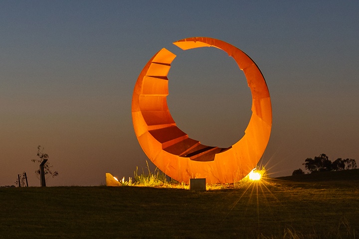 Aeolian sculpture lit up at night