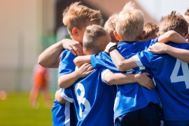 Children sports team huddle