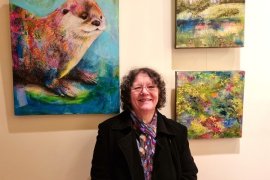 Shirley Dougan with her paintings