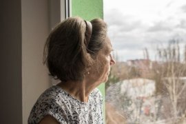 Woman looking out of window