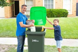 man and child with new food and garden bin
