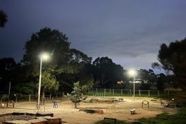 Image of Knox Park dog park at sunset with solar lights on