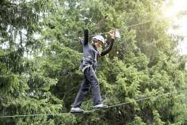 Young people on a high ropes course 