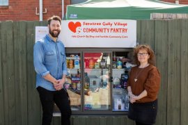 Drew Nicholls and Hills Church Op Shop manager Jeni McLean at the new pantry.