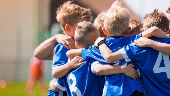 Children sports team huddle