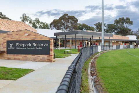 A Fairpark Reserve building that backs onto a fenced sporting field