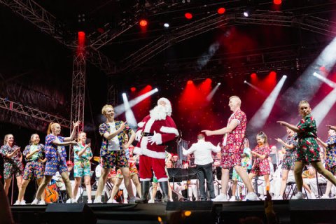 Santa and helpers on stage at Knox Carols