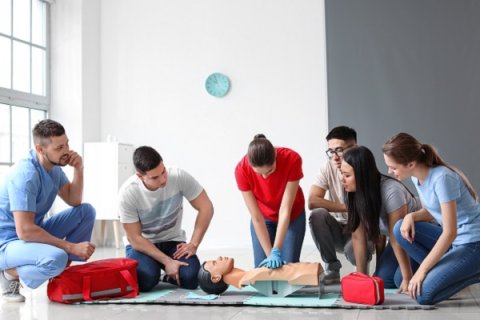 Young people doing first aid