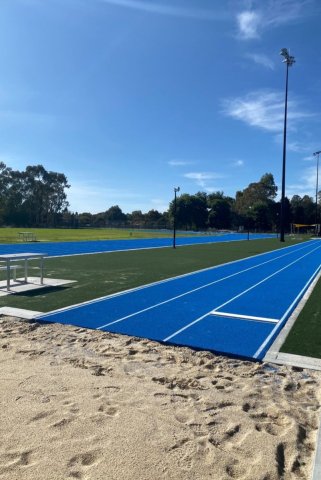 Blue long jump track and sandpit